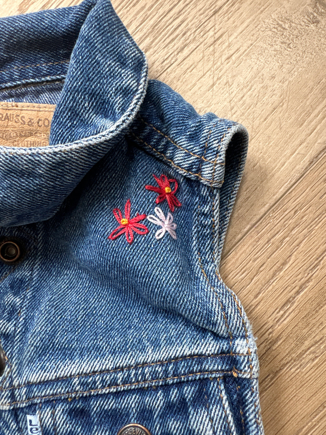 White tab vintage Levi vest with hand floral embroidery