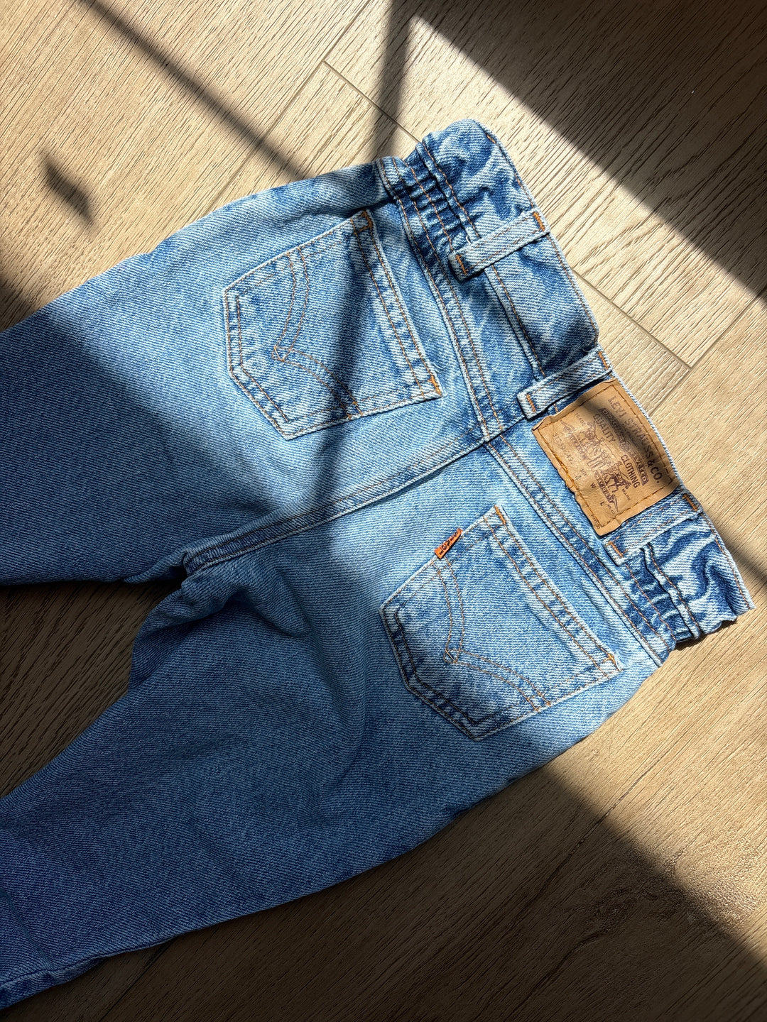Orange tab high waited Levi’s